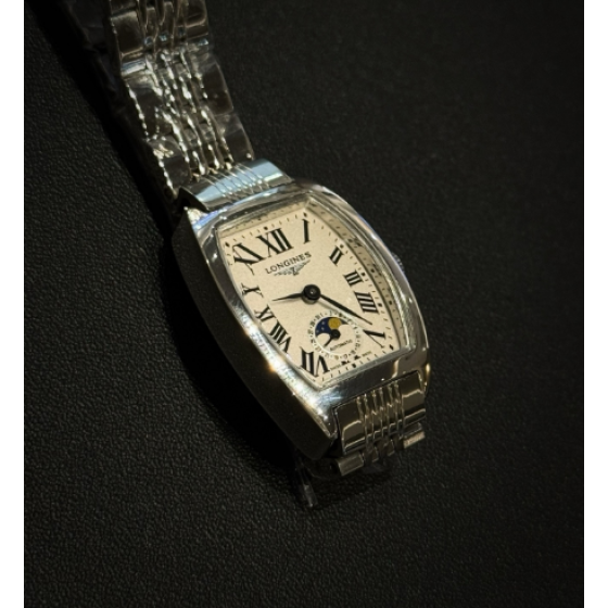 The Longines Heritage Collection L2.155.4.71.5 features a classic tonneau-shaped stainless steel case.